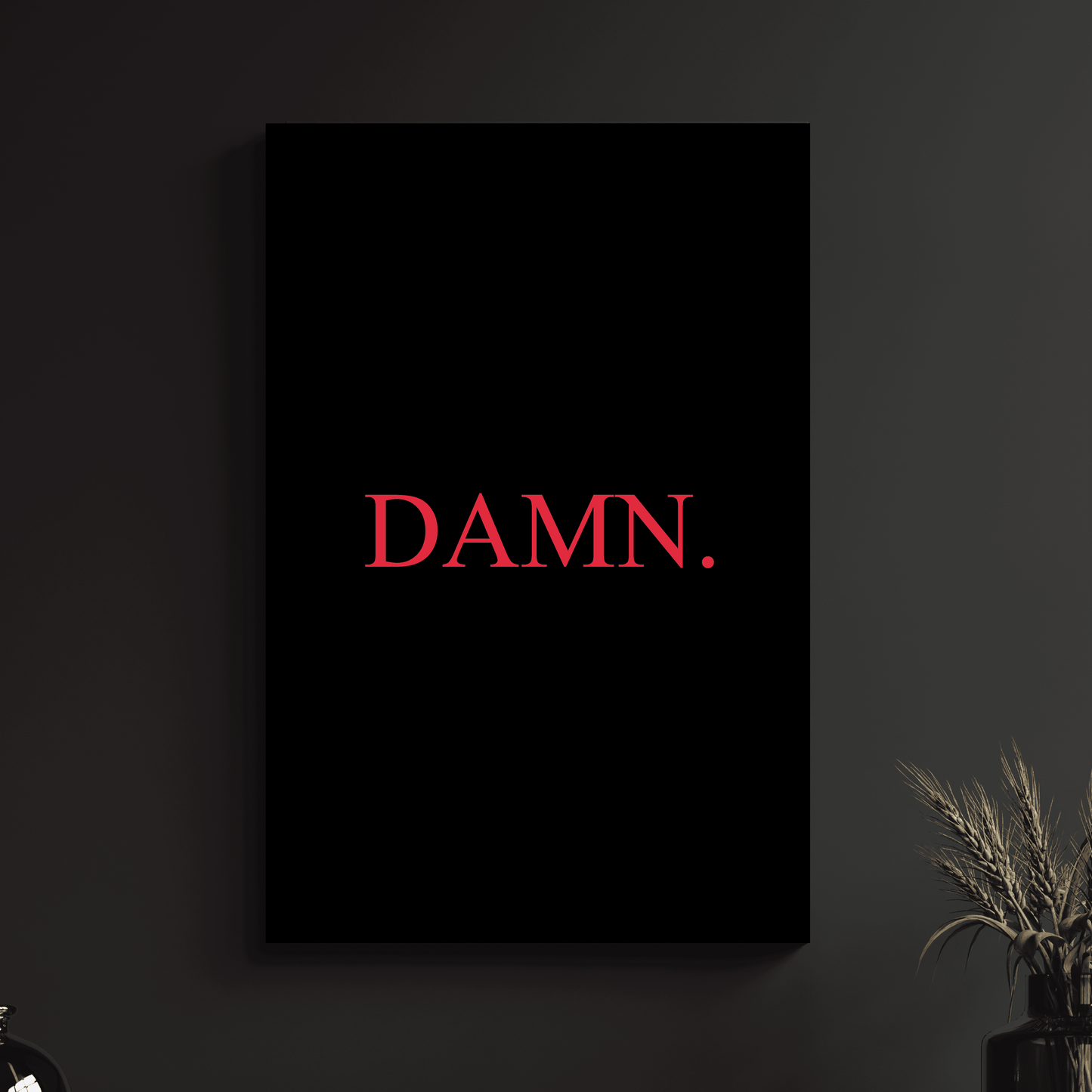 a black wall with a red word that says damn