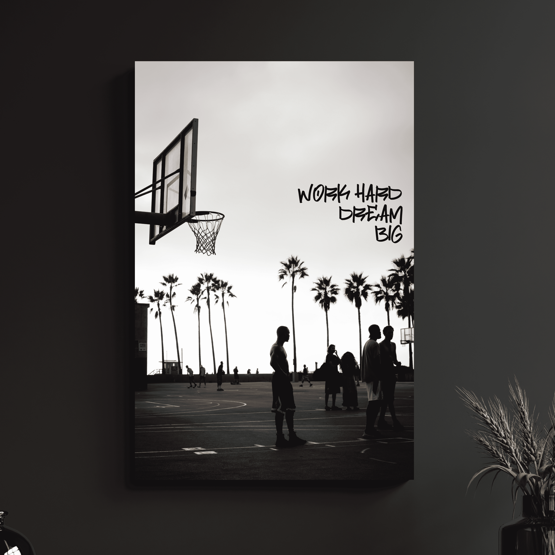 a black and white photo of people playing basketball