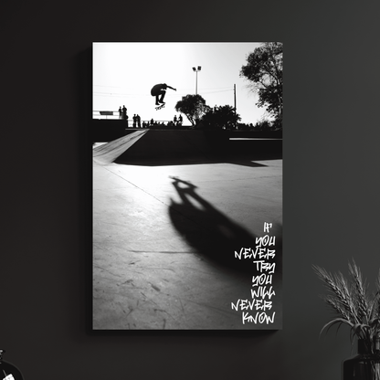 a black and white photo of a skateboarder doing a trick